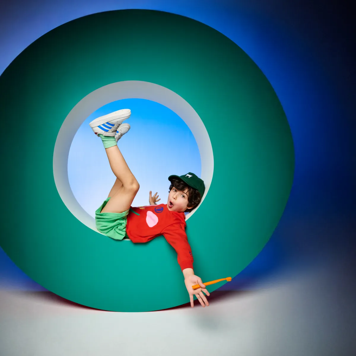 Boy holding kids toothbrush