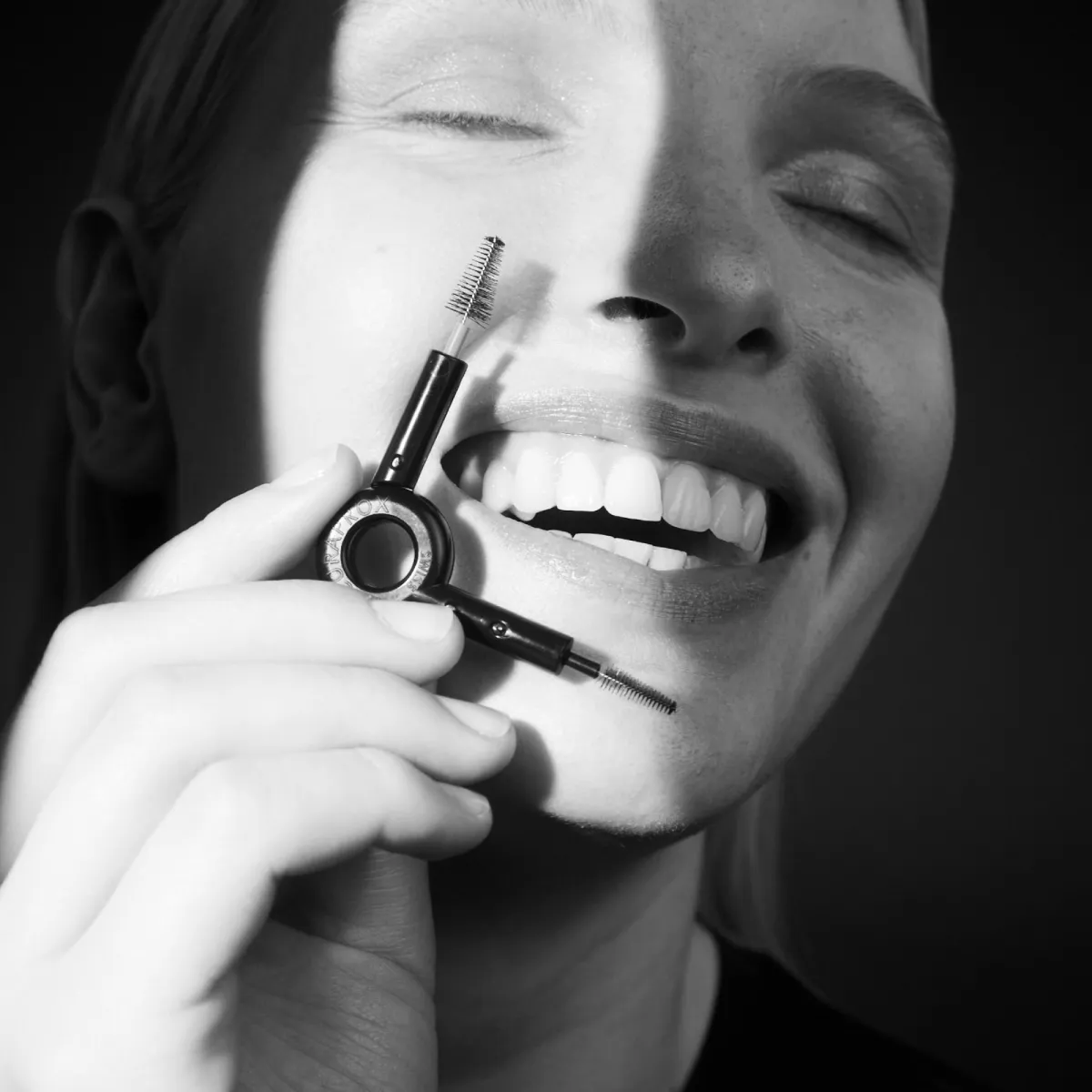 Woman holding interdental brush
